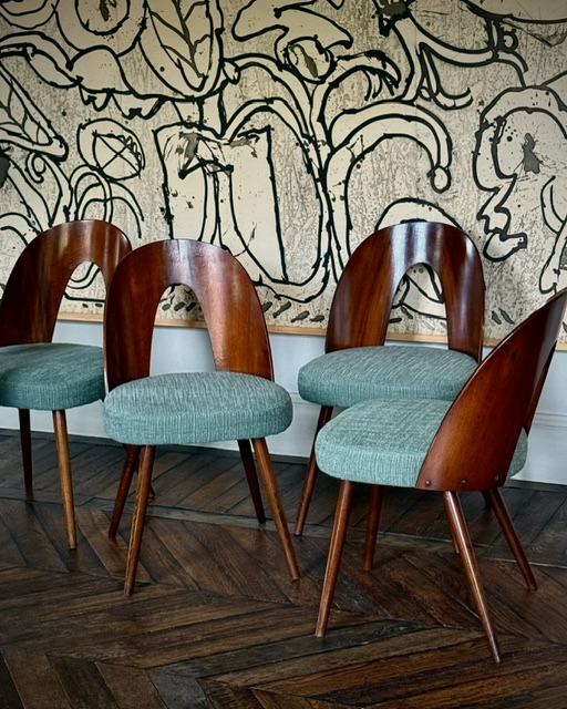 set of 8 dining chairs by Antonin Suman