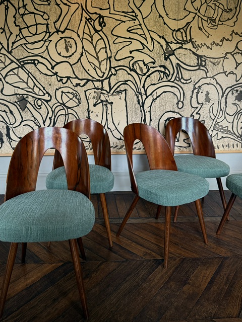 set of 8 dining chairs by Antonin Suman